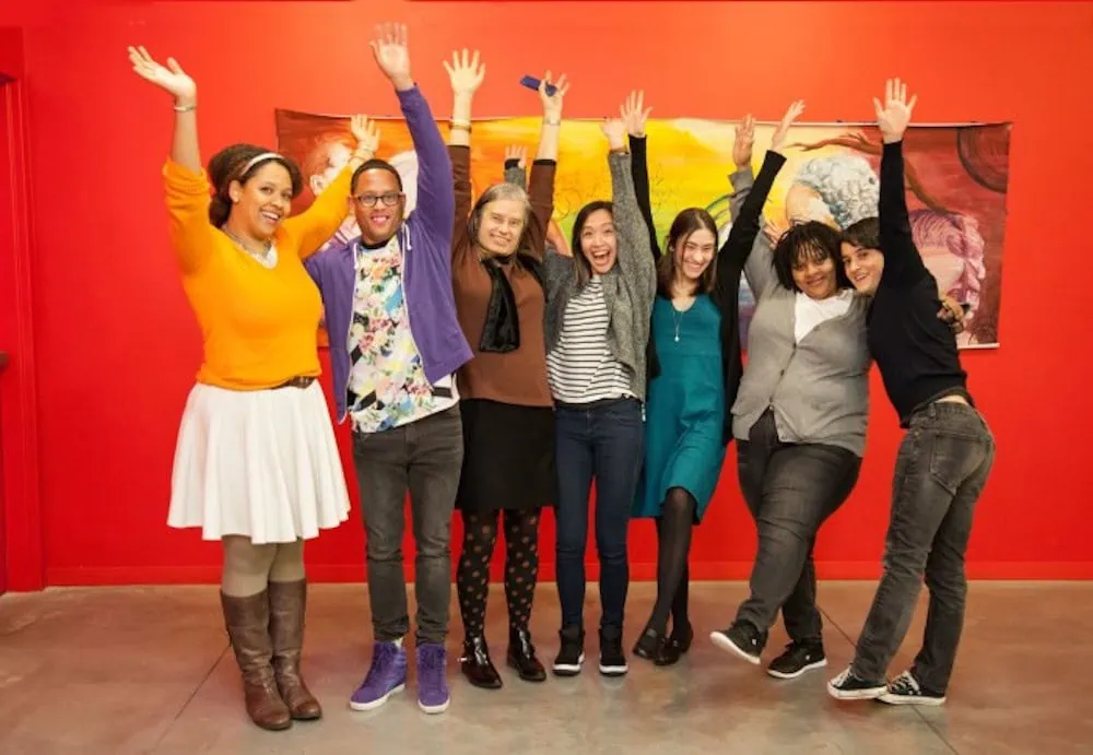 BCRW Staff with their hands up in the air